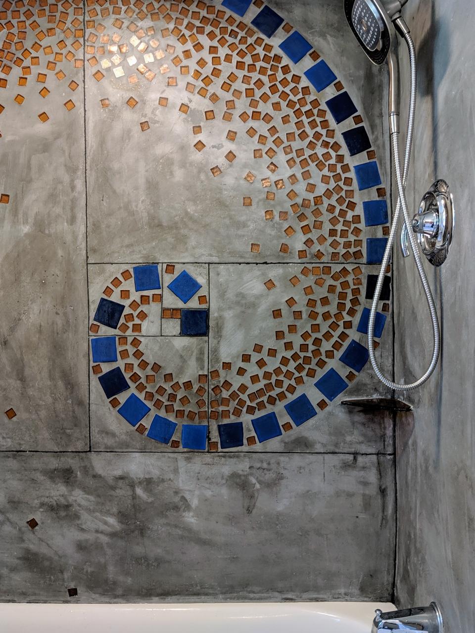 Stunning spiral mosaic tile artwork in shower