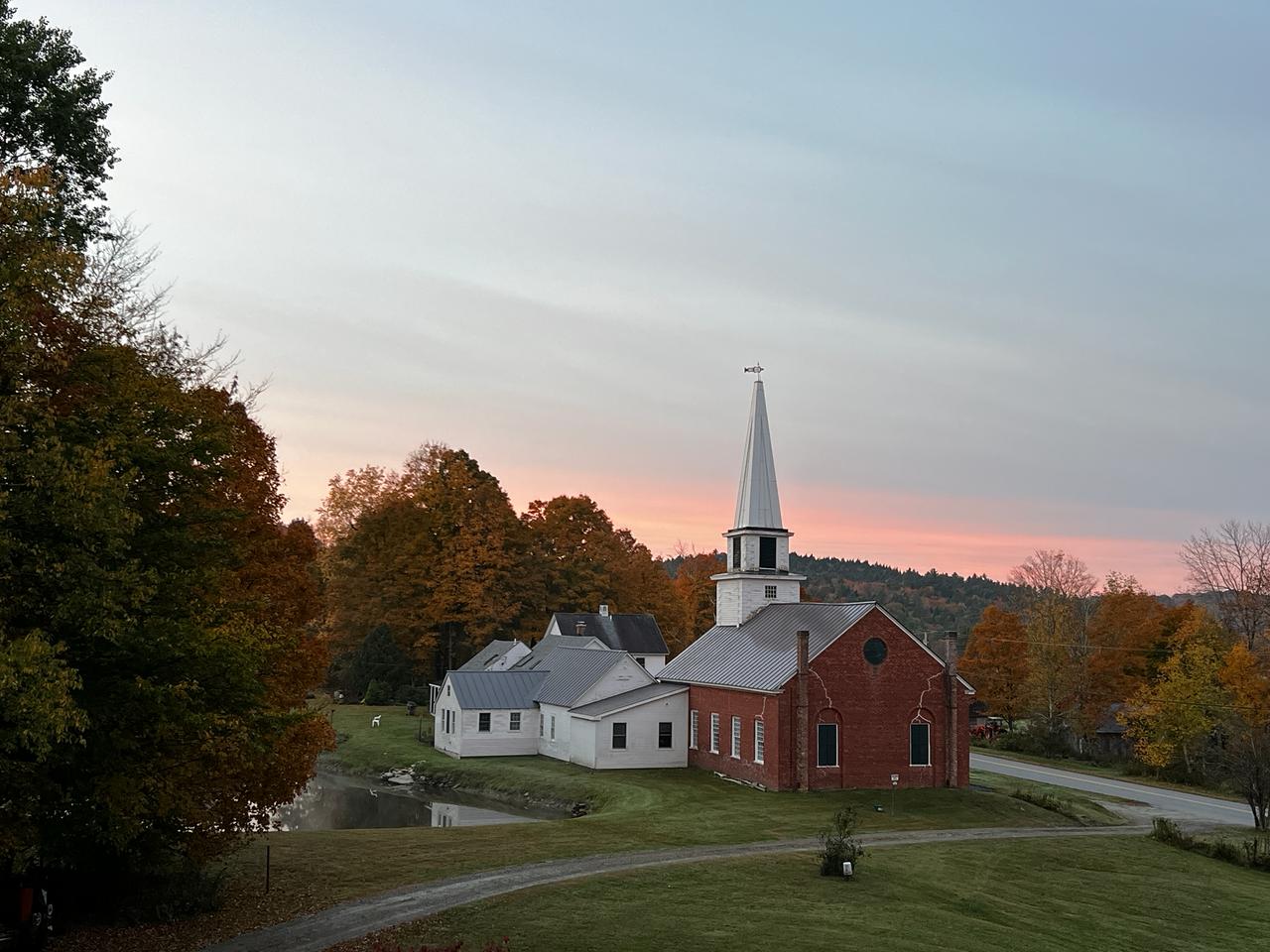 Village church at autumn sunset